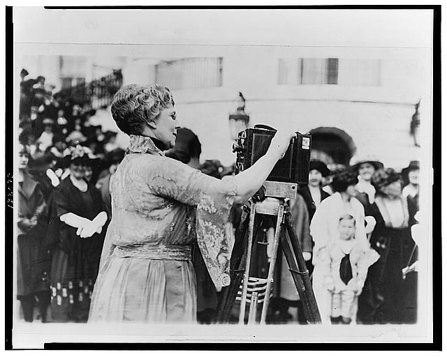 [Florence Kling Harding operating a movie camera on the...