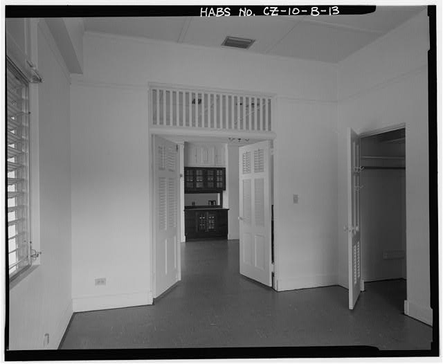 Interior view of bedroom 3 showing double doors to dining...