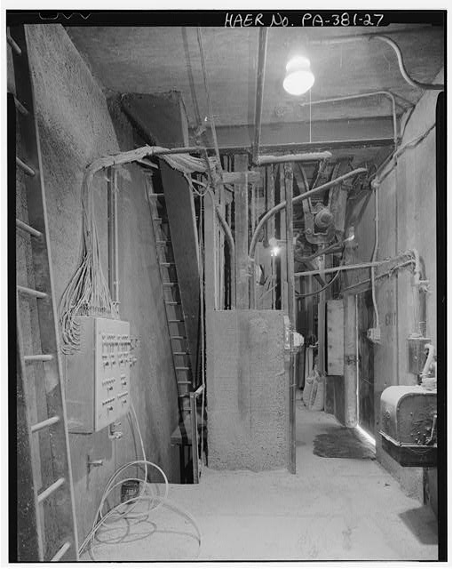 Inside the covered hopper car loading dock at railroad...