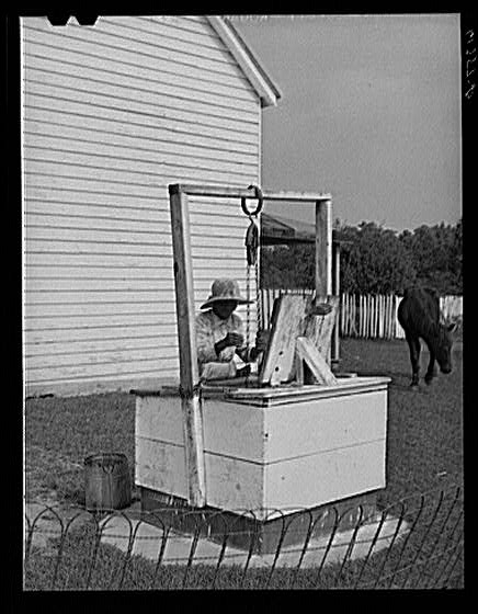 Aged FSA (Farm Security Administration) borrower drawing...
