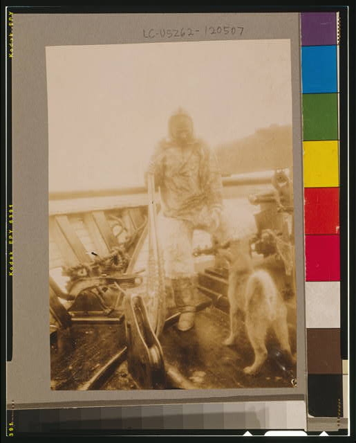 Matt Henson (of Peary's crew) in Arctic costume on deck...
