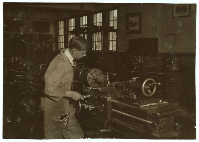 High School boy at work in machine shop. Oklahoma City...