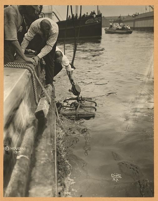 Crate containing Harry Houdini lowered into New York...