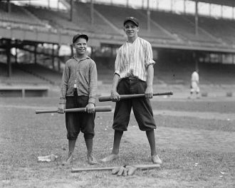 Unidentified boys in stadium with baseball bats