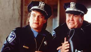 Jim Belushi and John Candy.
