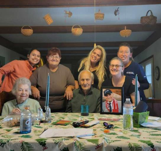 Sylvia E. Mayo on the left at the table.