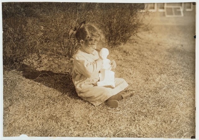 [Blind child making the acquaintance of a bit of statuary...