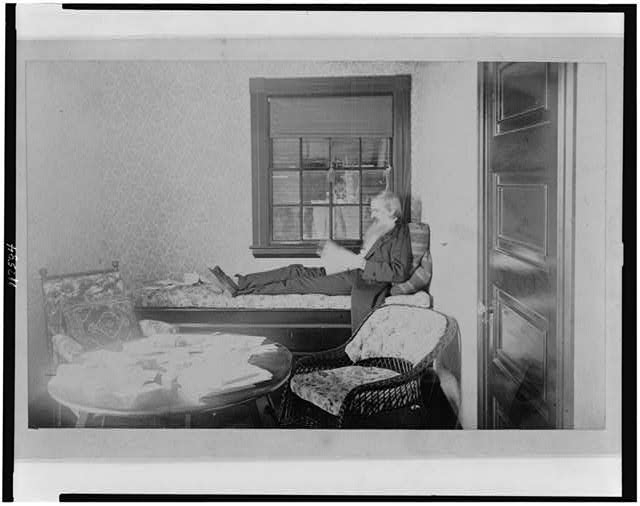 Gardiner Greene Hubbard reclining and reading