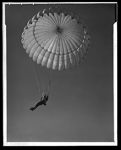 Fort Benning. Parachute troops. Look at that boy come,...