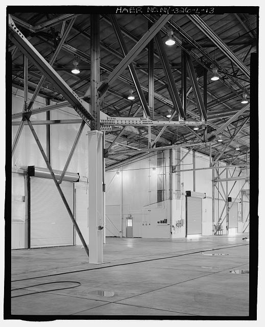 INTERIOR OF HANGAR AREA OF BUILDING, CANTILEVERED TRUSS....