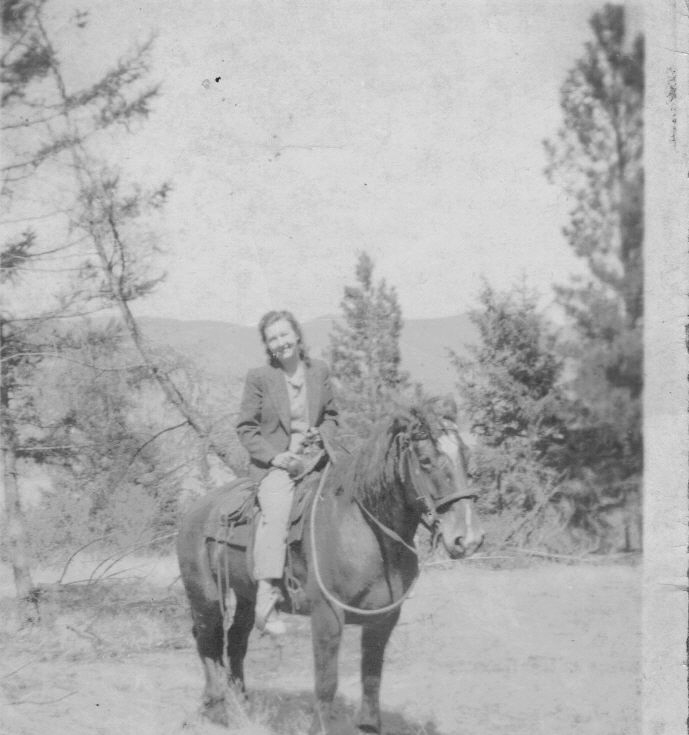 Uunknown female on horseback