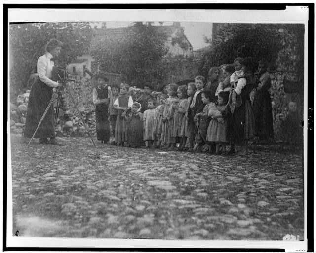 [Frances Benjamin Johnston photographing a group of...