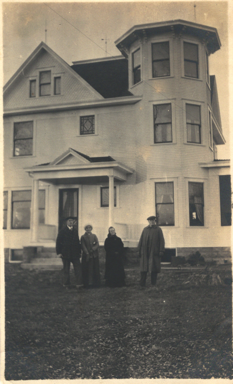 Four people and a house