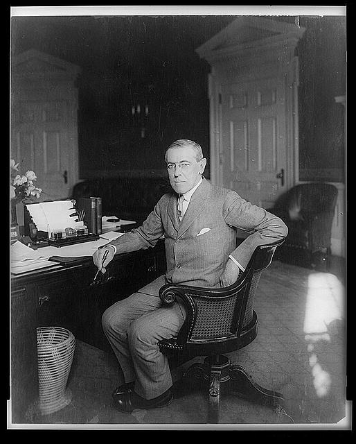 [Woodrow Wilson, full-length portrait, seated at desk,...