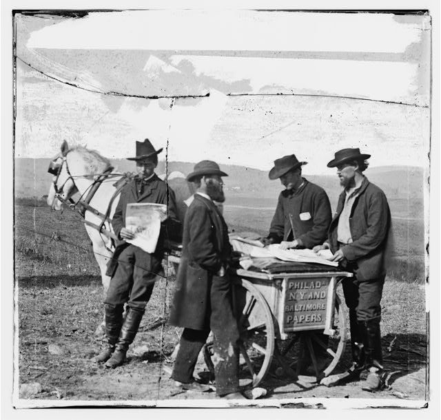 [Virginia. Newspaper vendor and cart in camp]