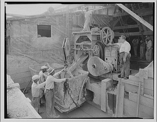Cement mixer. Unloading cement from mixer II
