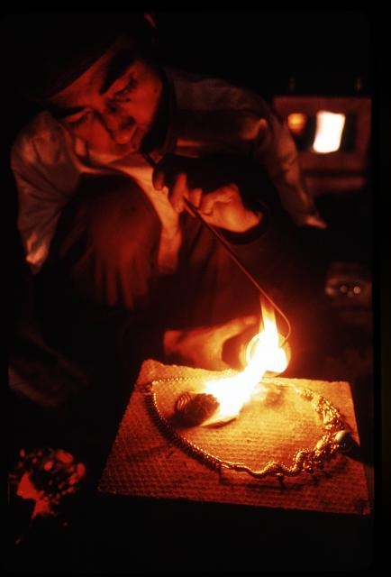 [Jeweler using blow torch? to make jewelry, Sikkim]