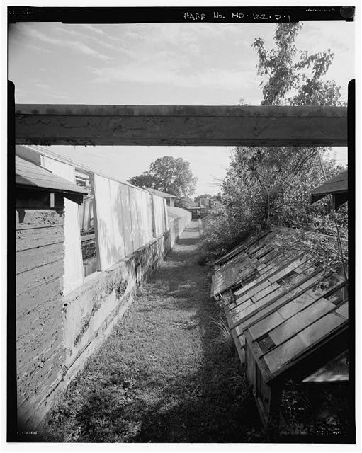 1. VIEW SOUTH. ALLEY BETWEEN GREENHOUSES #5 AND #6...