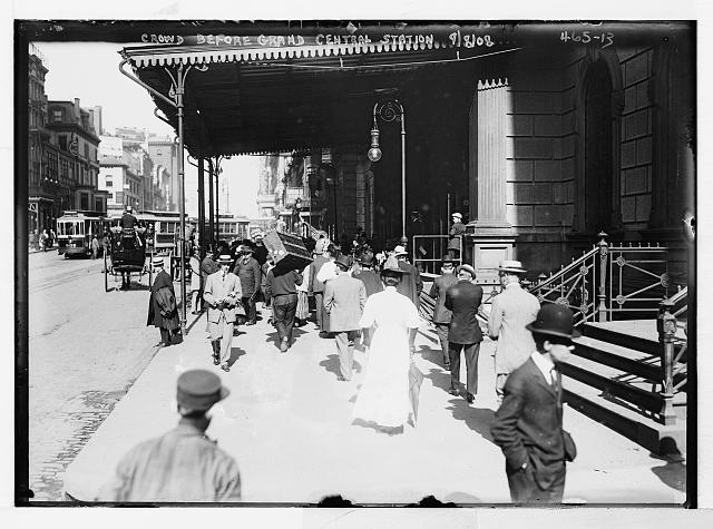 Porters and crowd outside Grand Central Station, New York