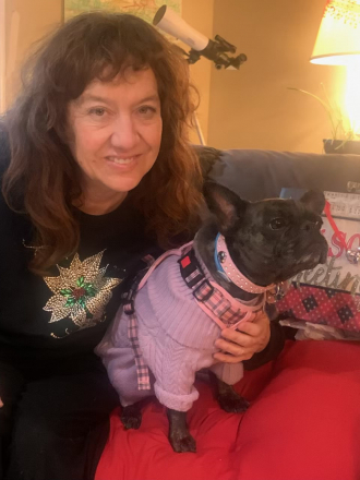Dawn Rothhammer in her Sacramento home dog sitting. Taken March 2025