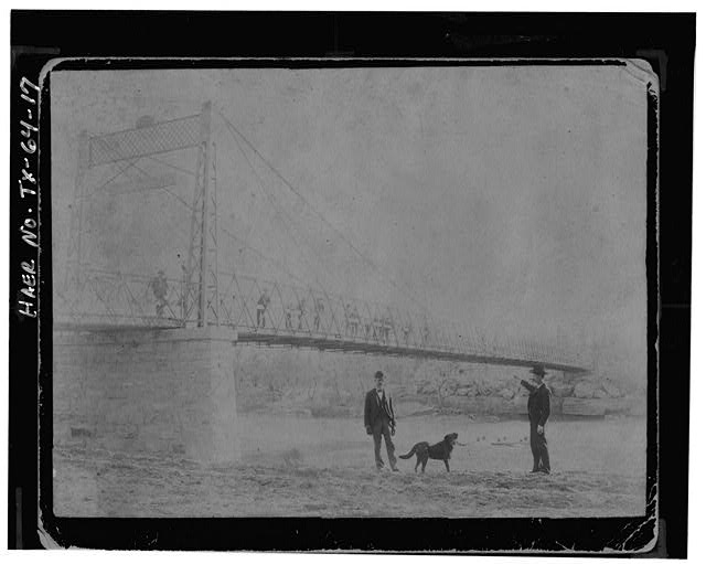UNIDENTIFIED CATENARY SUSPENSION BRIDGE WITH TRUSSED...