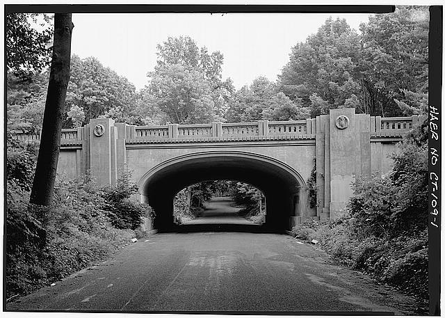 1. VIEW ALONG HILLSIDE ROAD TO BRIDGE CARRYING THE...