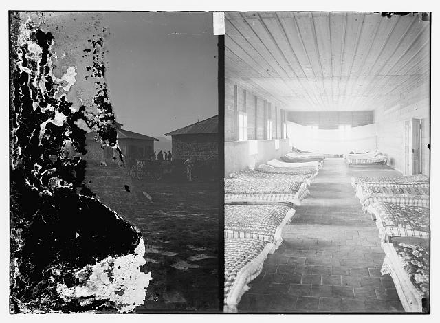 [People next to buildings (left); mattresses on floor...