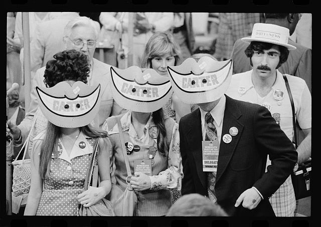 [Delegates wearing Jimmy Carter smile masks at the...
