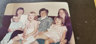 Bella Houston with her two Daughters-in-law and three Grandchildren.