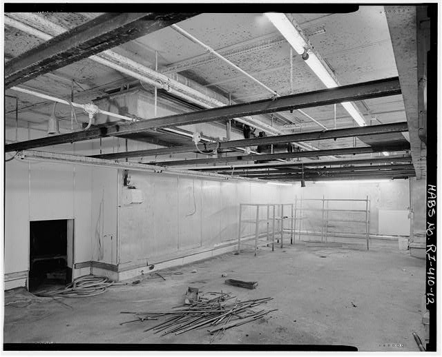 12. Interior view of first floor, facing east in a former...
