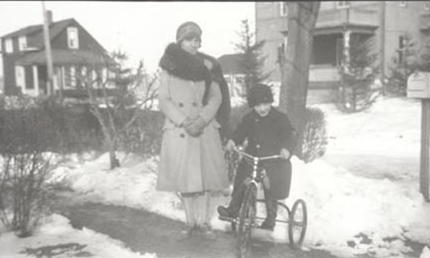 Woman and boy on bicycle