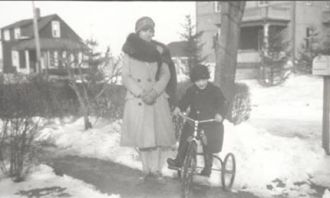 Woman and boy on bicycle