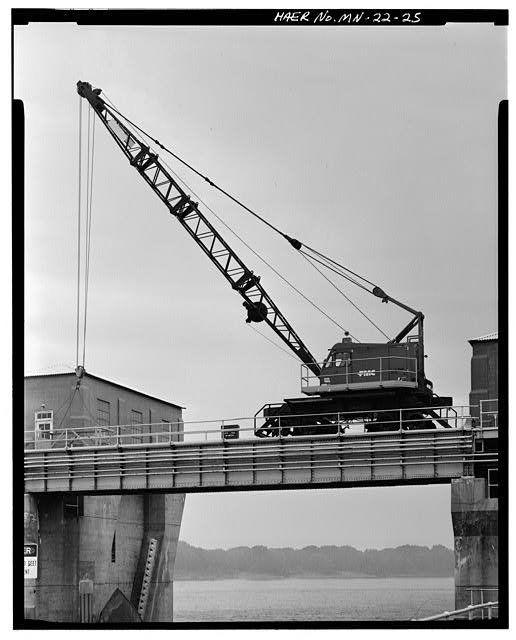 25. VIEW OF MOVABLE CRANE ON DAM BRIDGE, WITH ROLLER GATE...
