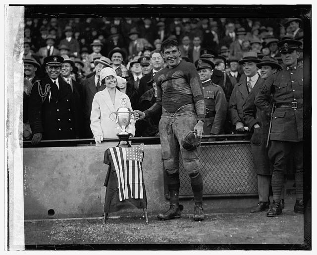 Mrs. Coolidge & Lt. McQuade, Marine - Fort Benning game,...
