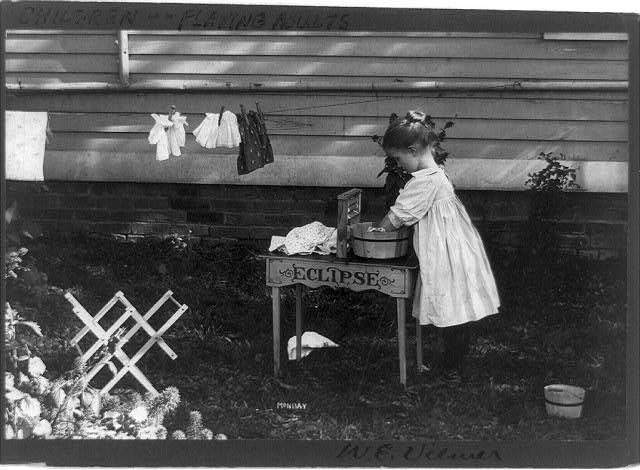 [Little girl playing--doing laundry]