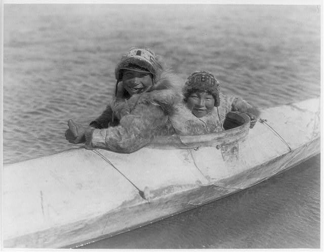 Boys in a kaiak (i.e., kayak)--Nunivak