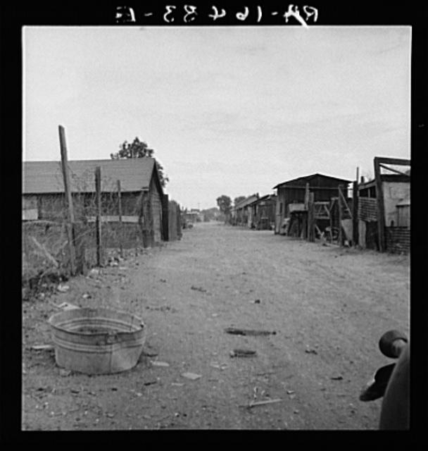 Slums of East El Centro, California. Typical of housing...