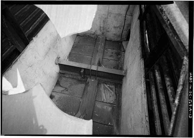 13. LOOKING THROUGH BROKEN SKYLIGHT ABOVE THE STAIRWELL...