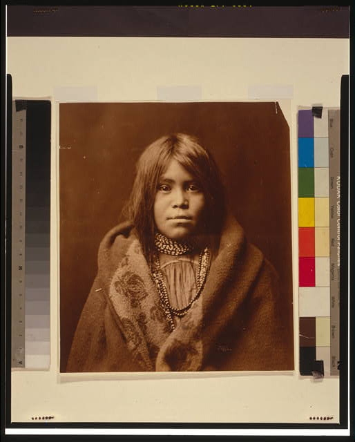 [An Apache girl, head-and-shoulders portrait, facing...