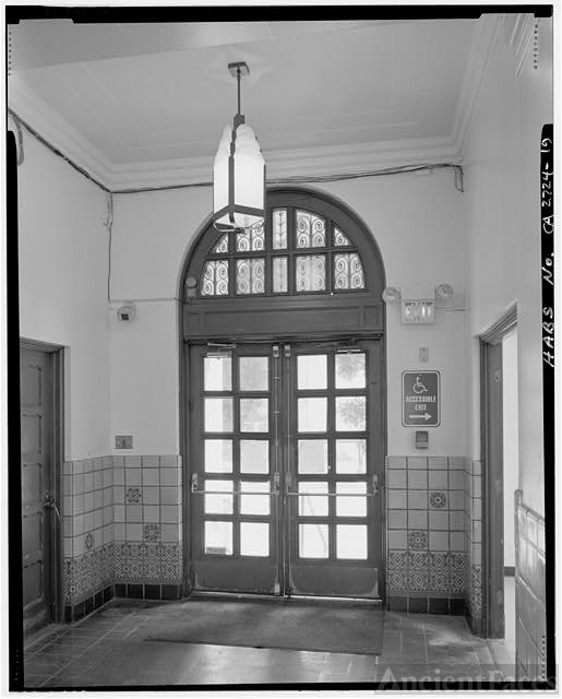 Interior view of front entry door included art deco light...