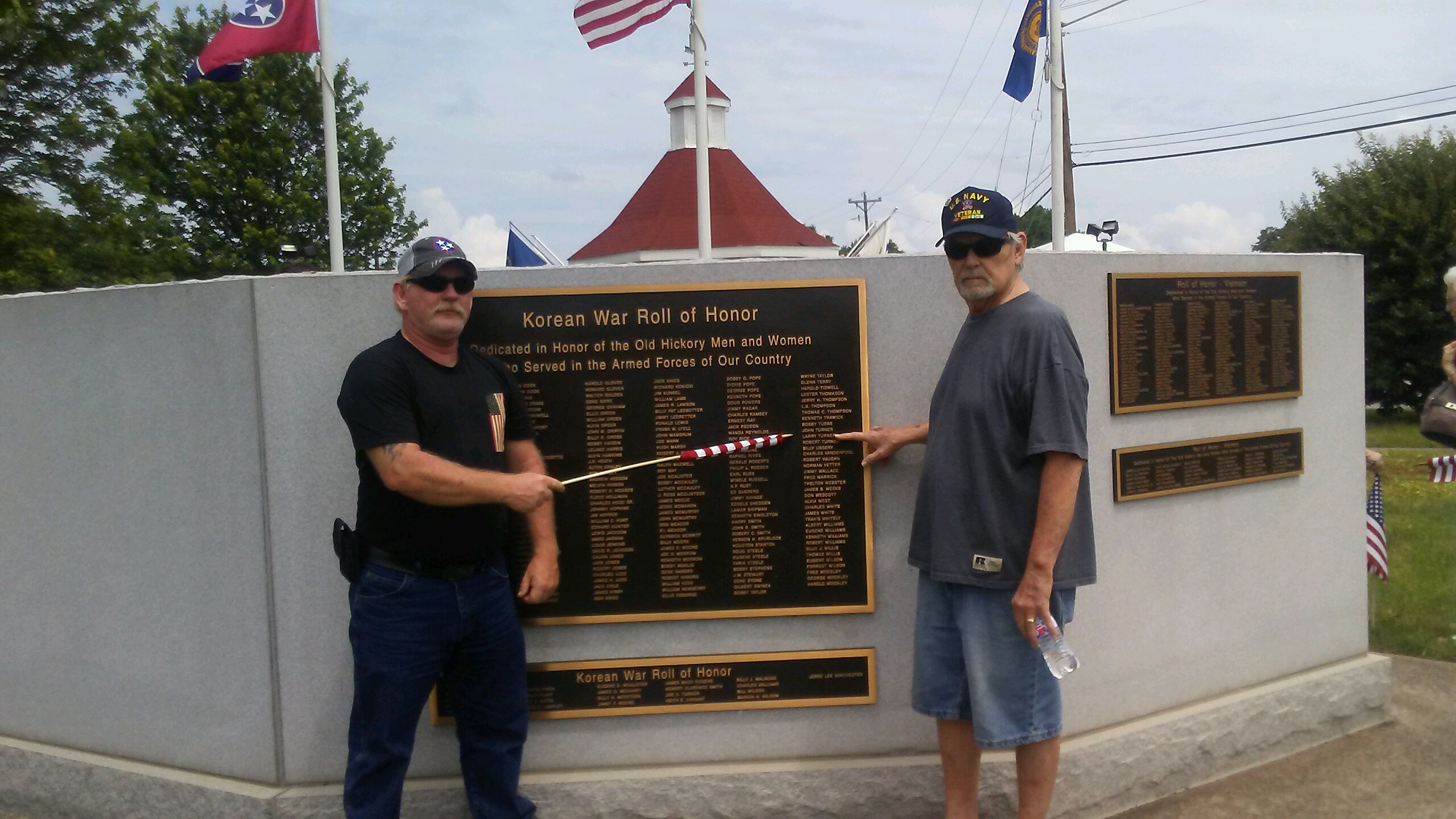 Claude Turner w/ cousin Larry Dickens. Pointing to his daddy's name on the veterans wall in the Village in Old Hickory,TN