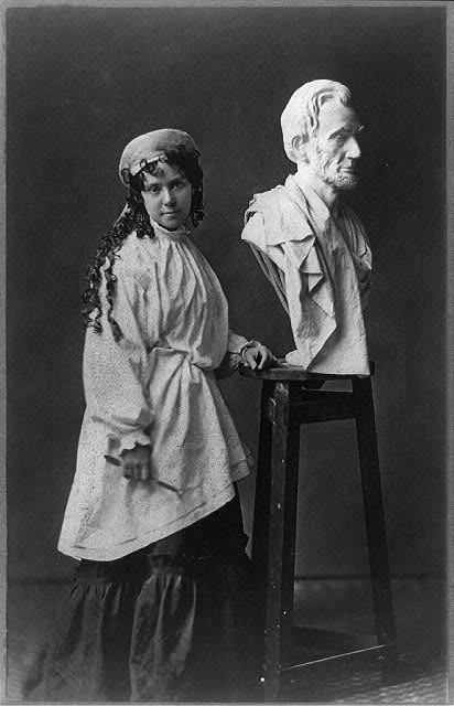 Vinnie Ream at work upon her Lincoln bust which rests...