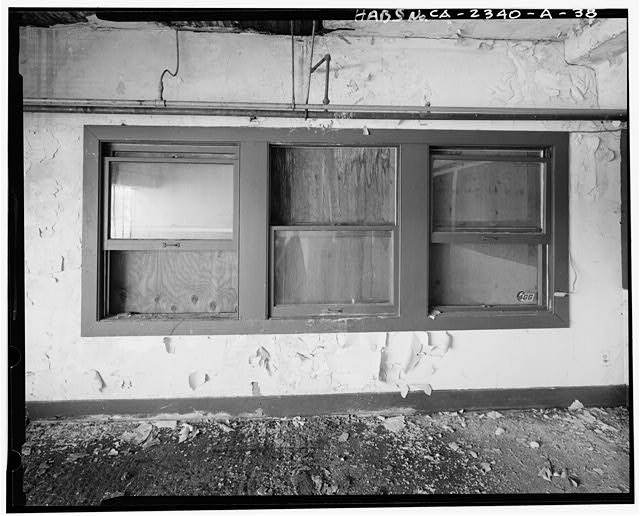 View to east of windows overlooking interior of adjoining...
