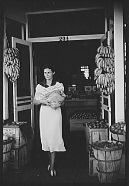 Shopper coming out of grocery store, Lakeland, Florida