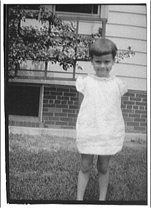 West Virginia trip. Small girl with hands behind back