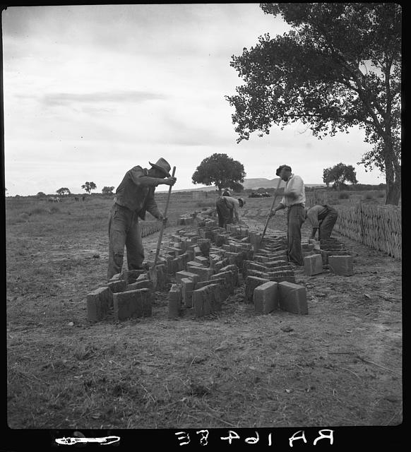 Making adobe bricks. Bosque Farms project, New Mexico....