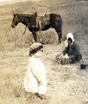 Lady, child and horse on the prairie of Oklahoma Lady, child and horse on the prairie of Oklahoma