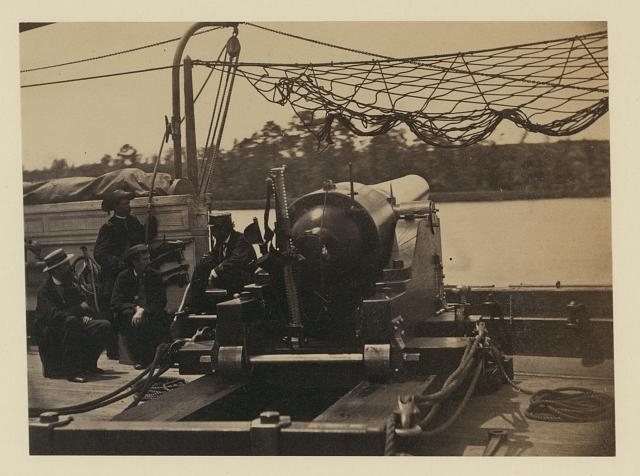 Bringing parrott gun into position on board gun boat...