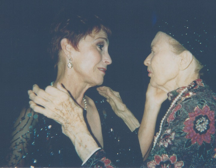 Julie May Wilson being caressed by Amanda McBroom.