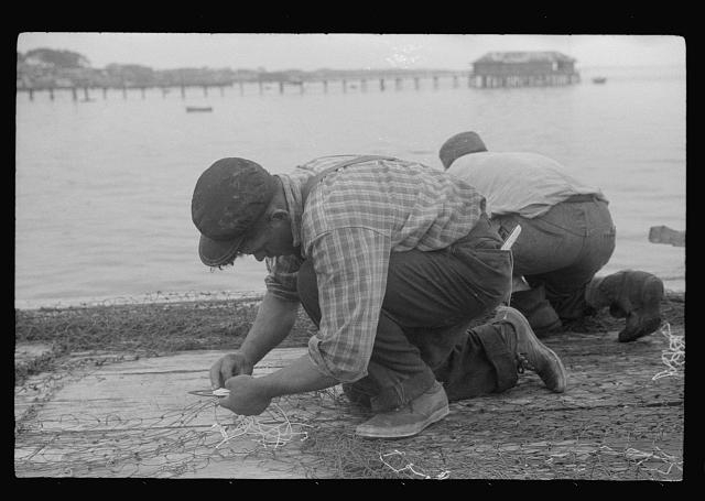 Fishermen repairing nets, Provincetown, Massachusetts